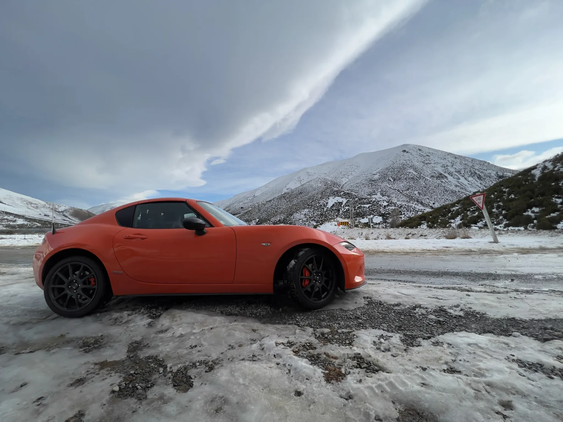 Mazda MX-5 parked in the snow.